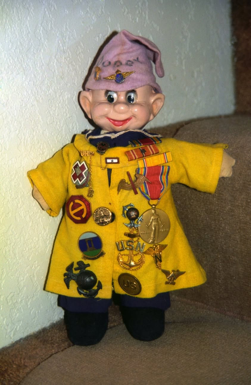 Grandma AraBelle's Dopey doll and Pearl Harbor memorabilia.