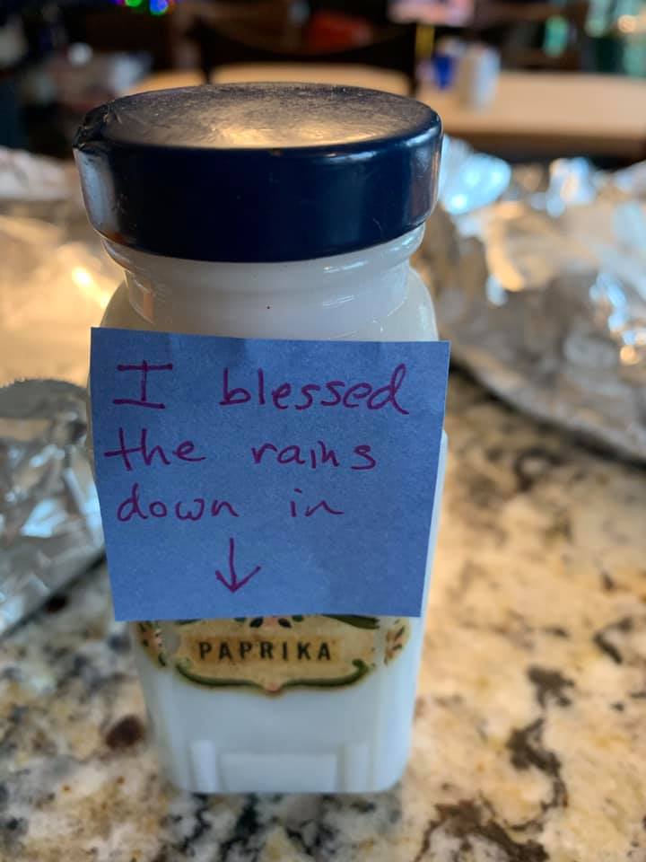 Paprika jar on a kitchen counter with a note reading “I blessed the rains down in” and an arrow pointing to the label.
