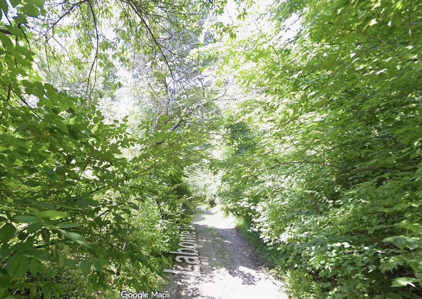 A second photo from the boy's holiday delivery trip on muddy, barely paved roads.